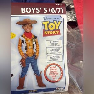New Woody from Toy Story deluxe costume. Plus bonus slippers and bag